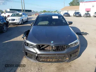 2019 BMW M5 Competition z VIN WBSJF0C59KB447419, wystawiony jako IAAI lot #41997505 z przebiegiem 74 990 mil mil oraz . Historia ofert i sprzedaży dostępna na DreamBid. Obrazek 12.