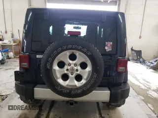 2013 Jeep Wrangler Sahara z VIN 1C4AJWBG4DL504800, wystawiony jako Copart lot #60504575 z przebiegiem 166 687 mil mil oraz Szkoda całkowita • Salvage title. Historia ofert i sprzedaży dostępna na DreamBid. Obrazek 6.