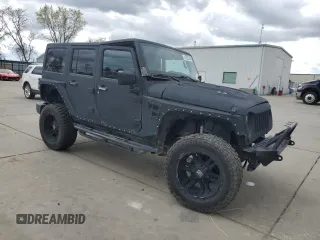 2015 Jeep Wrangler Unlimited Wrangler X with VIN 1C4HJWEG7FL649231, listed as a Copart auction lot 47972905 with 133,895 mi miles and Salvage title. Bid and sale history available at DreamBid. Image 4.