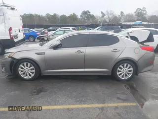 2014 Kia Optima EX z VIN 5XXGN4A75EG290132, wystawiony jako IAAI lot #41292706 z przebiegiem 155 793 mil mil oraz . Historia ofert i sprzedaży dostępna na DreamBid. Obrazek 14.