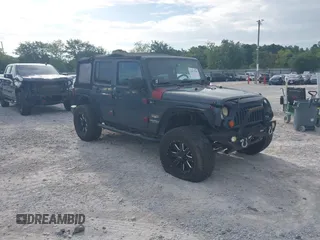 2007 Jeep Wrangler Unlimited Sahara with VIN 1J4GB59167L221686, listed as a IAAI auction lot 42473996 with 151,065 mi miles and . Bid and sale history available at DreamBid. Image 1.
