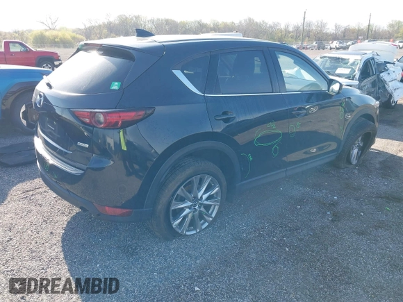 2019 Mazda CX-5 Grand Touring with VIN JM3KFBDM7K0525650, listed as a IAAI auction lot 42032757 with 65,530 mi miles and . Bid and sale history available at DreamBid. Image 4.