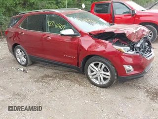 2018 Chevrolet Equinox Premier z VIN 2GNAXMEV3J6329268, wystawiony jako IAAI lot #42240907 z przebiegiem 61 487 mil mil oraz . Historia ofert i sprzedaży dostępna na DreamBid. Obrazek 1.