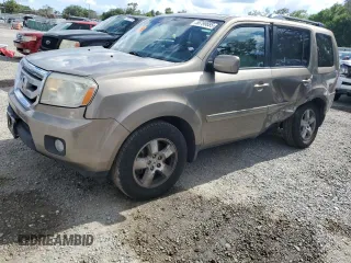 2011 Honda Pilot EX-L z VIN 5FNYF4H69BB026277, wystawiony jako Copart lot #56799885 z przebiegiem 169 664 mil mil oraz Szkody całkowita. Historia ofert i sprzedaży dostępna na DreamBid. Obrazek 1.