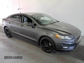 2020 Ford Fusion SE z VIN 3FA6P0HD6LR189762, wystawiony jako IAAI lot #42780149 z przebiegiem 51 099 mil mil oraz . Historia ofert i sprzedaży dostępna na DreamBid. Obrazek 9.