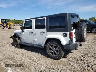 2018 Jeep Wrangler JK Unlimited Sahara with VIN 1C4HJWEG7JL910656, listed as a Copart auction lot 73414244 with 50,519 mi miles and Salvage Title. Bid and sale history available at carsss.com. Image 2.