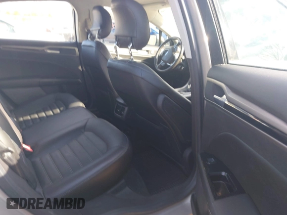 2015 Ford Fusion SE Hybrid with VIN 3FA6P0LUXFR133979, listed as a IAAI auction lot 41831288 with 143,738 mi miles. Bid and sale history available at carsss.com. Image 8.
