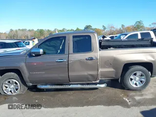 2014 Chevrolet Silverado 1500 LT with VIN 1GCRCREH5EZ165367, listed as a IAAI auction lot 41076729 with 130,425 mi miles and . Bid and sale history available at DreamBid. Image 14.