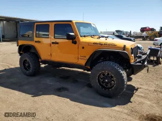 2012 Jeep Wrangler Unlimited Sport with VIN 1C4BJWDG8CL207111, listed as a Copart auction lot 51208395 with 87,926 mi miles and Salvage Title. Bid and sale history available at carsss.com. Image 4.