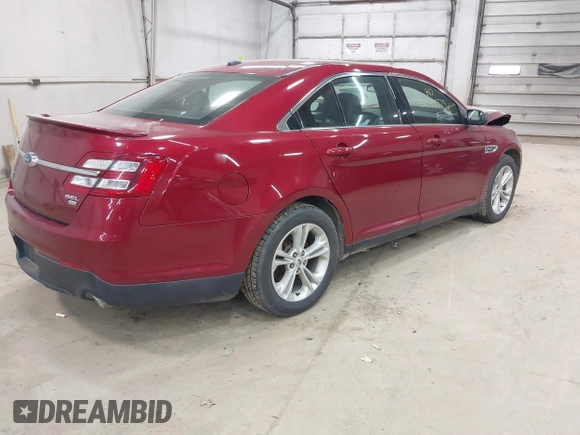 2015 Ford Taurus SEL z VIN 1FAHP2H88FG163179, wystawiony jako IAAI lot #42345579 z przebiegiem 142 424 mil mil oraz . Historia ofert i sprzedaży dostępna na DreamBid. Obrazek 4.