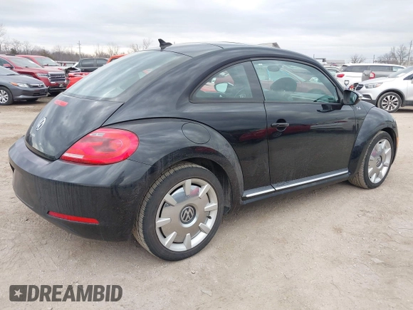 2013 Volkswagen Beetle 2.5L with VIN 3VWJP7AT8DM679548, listed as a IAAI auction lot 41459613 with 135,198 mi miles and . Bid and sale history available at DreamBid. Image 4.