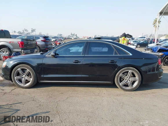 2011 Audi A8 with VIN WAUAVAFD6BN023937, listed as a IAAI auction lot 41288464 with 158,127 mi miles and . Bid and sale history available at DreamBid. Image 14.