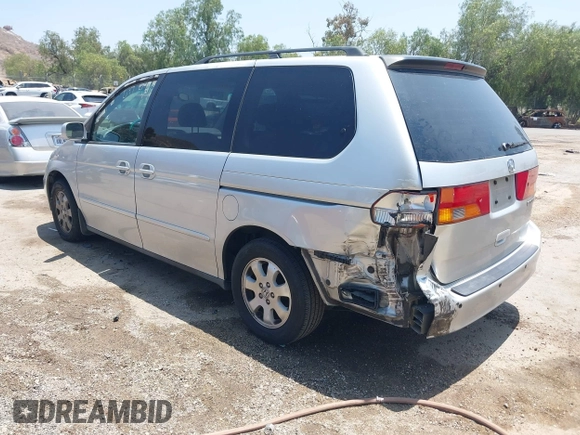 2004 Honda Odyssey EX-L with VIN 5FNRL18774B028164, listed as a IAAI auction lot 42454877 with 135,720 mi miles and . Bid and sale history available at DreamBid. Image 3.