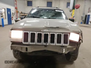 1998 Jeep Grand Cherokee Laredo with VIN 1J4GZ58S3WC207166, listed as a Copart auction lot 84243704 with 124,084 mi miles and Salvage Title. Bid and sale history available at carsss.com. Image 5.
