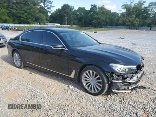 2017 BMW 7 Series 740i with VIN WBA7E2C57HG739482, listed as a Copart auction lot 53652145 with 102,418 mi miles and Salvage title. Bid and sale history available at DreamBid. Image 4.