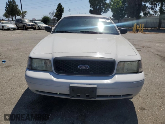 2011 Ford Police Interceptor with VIN 2FABP7BV4BX167977, listed as a Copart auction lot 61819025 with 104,769 mi miles and Salvage title. Bid and sale history available at DreamBid. Image 5.