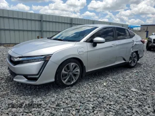 2018 Honda Clarity Touring z VIN JHMZC5F3XJC006366, wystawiony jako Copart lot #56400725 z przebiegiem Nie podano mil oraz Szkoda całkowita • Salvage title. Historia ofert i sprzedaży dostępna na DreamBid. Obrazek 1.