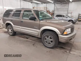 2001 Oldsmobile Bravada z VIN 1GHDT13W812133670, wystawiony jako IAAI lot #42224085 z przebiegiem 159 995 mil mil oraz . Historia ofert i sprzedaży dostępna na DreamBid. Obrazek 1.