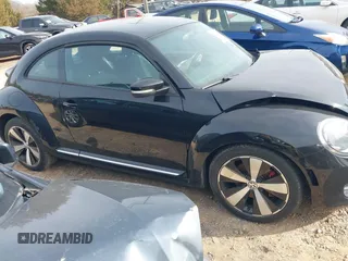 2012 Volkswagen Beetle 2.0T Turbo w/Sun/Snd/Nav PZEV with VIN 3VWVA7AT4CM655068, listed as a IAAI auction lot 41605197 with 115,546 mi miles. Bid and sale history available at carsss.com. Image 13.