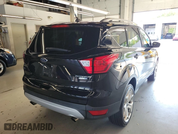 2019 Ford Escape Titanium with VIN 1FMCU9J96KUA01051, listed as a IAAI auction lot 42841649 with 69,720 mi miles and . Bid and sale history available at DreamBid. Image 12.