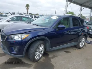 2014 Mazda CX-5 Grand Touring with VIN JM3KE2DY1E0307911, listed as a IAAI auction lot 42064898 with 133,934 mi miles. Bid and sale history available at carsss.com. Image 15.