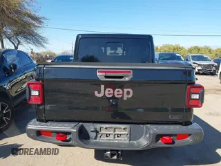 2020 Jeep Gladiator Rubicon z VIN 1C6JJTBG0LL117908, wystawiony jako IAAI lot #41621920 z przebiegiem 61 233 mil mil oraz . Historia ofert i sprzedaży dostępna na DreamBid. Obrazek 16.