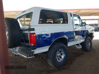 1996 Ford Bronco Custom with VIN 1FMEU15H3TLB30609, listed as a IAAI auction lot 42053896 with 238,597 mi miles. Bid and sale history available at carsss.com. Image 4.