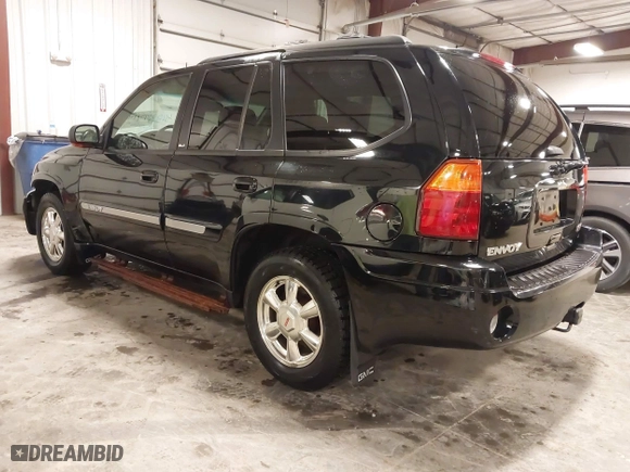 2004 GMC Envoy SLE with VIN 1GKDT13S542265104, listed as a IAAI auction lot 41884797 with 154,190 mi miles. Bid and sale history available at carsss.com. Image 3.