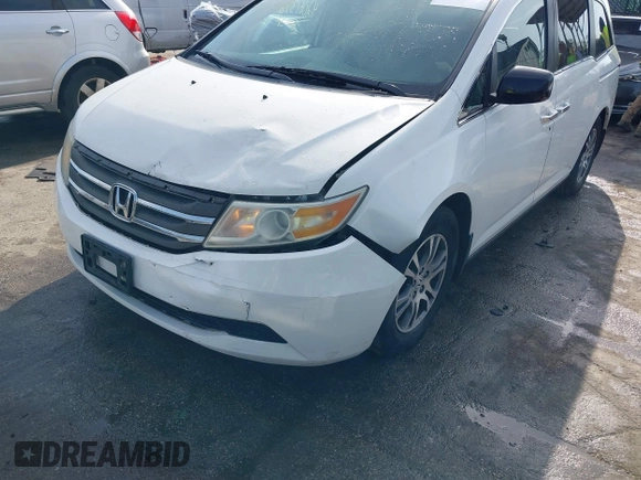 2011 Honda Odyssey EX-L with VIN 5FNRL5H6XBB059162, listed as a IAAI auction lot 42061378 with 164,317 mi miles and . Bid and sale history available at carsss.com. Image 6.