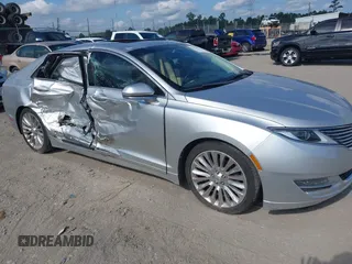 2014 Lincoln MKZ z VIN 3LN6L2G96ER821995, wystawiony jako IAAI lot #42624614 z przebiegiem 106 353 mil mil oraz . Historia ofert i sprzedaży dostępna na DreamBid. Obrazek 1.