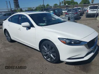 2020 Mazda 6 Touring with VIN JM1GL1VM9L1520784, listed as a IAAI auction lot 41967411 with 59,129 mi miles. Bid and sale history available at carsss.com. Image 1.