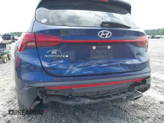 2021 Hyundai Santa Fe SE with VIN 5NMS14AJ2MH323542, listed as a IAAI auction lot 42182576 with 69,385 mi miles and . Bid and sale history available at DreamBid. Image 6.