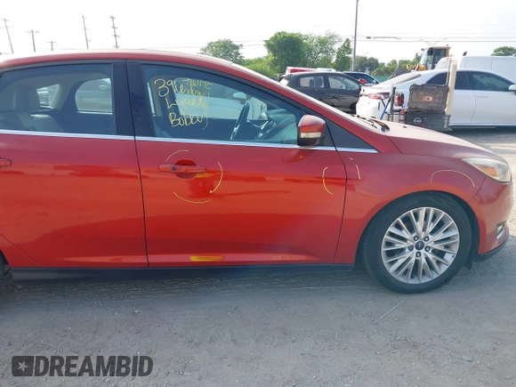 2018 Ford Focus Titanium z VIN 1FADP3N24JL313938, wystawiony jako IAAI lot #42050701 z przebiegiem 162 859 mil mil oraz . Historia ofert i sprzedaży dostępna na DreamBid. Obrazek 14.
