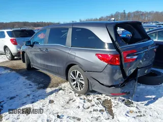 2023 Honda Odyssey Touring with VIN 5FNRL6H80PB005769, listed as a IAAI auction lot 41280858 with 7,041 mi miles and . Bid and sale history available at DreamBid. Image 3.