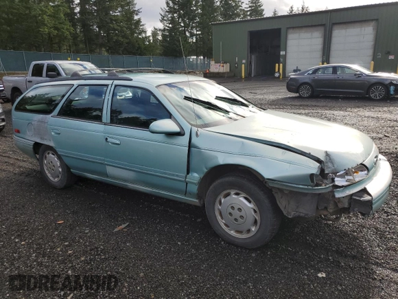 1994 Ford Taurus with VIN 1FALP5747RG236623, listed as a Copart auction lot 85242504 with 205,550 mi miles and Salvage title. Bid and sale history available at DreamBid. Image 4.