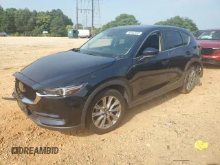 2020 Mazda CX-5 Grand Touring with VIN JM3KFBDMXL1817904, listed as a Copart auction lot 62402995 with 57,575 mi miles and Salvage title. Bid and sale history available at DreamBid. Image 1.