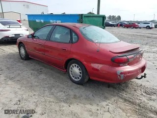1998 Ford Taurus SE Comfort with VIN 1FAFP53S2WA255080, listed as a IAAI auction lot 41541015 with 196,604 mi miles. Bid and sale history available at carsss.com. Image 3.