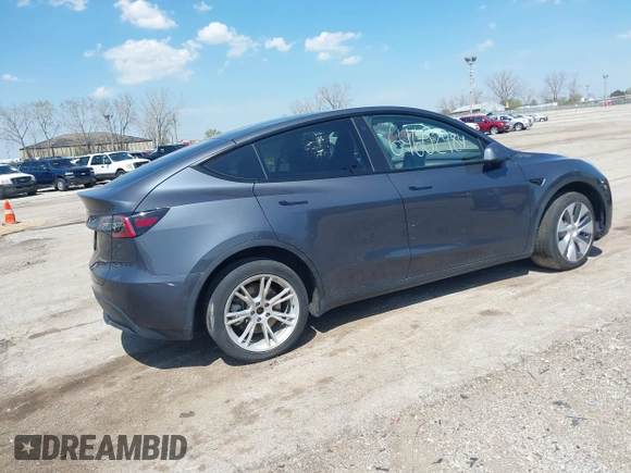 2022 Tesla Model Y Long Range with VIN 7SAYGDEE3NA007737, listed as a IAAI auction lot 42128359 with 42,597 mi miles and . Bid and sale history available at carsss.com. Image 4.