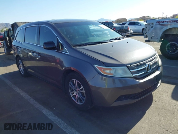 2011 Honda Odyssey EX-L with VIN 5FNRL5H6XBB083980, listed as a IAAI auction lot 42100308 with 191,361 mi miles and . Bid and sale history available at carsss.com. Image 1.