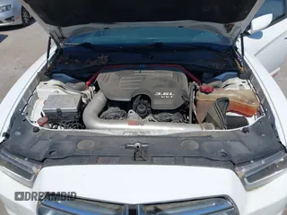 2014 Dodge Charger SE with VIN 2C3CDXBG2EH258886, listed as a IAAI auction lot 42104999 with 185,723 mi miles. Bid and sale history available at carsss.com. Image 10.