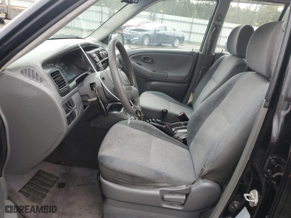 2000 Chevrolet Tracker with VIN 2CNBJ13C2Y6908949, listed as a Copart auction lot 79817914 with 212369 miles and Salvage Title. Bid and sale history available at carsss.com. Image 7.