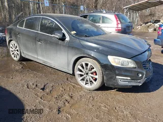 2015 Volvo S60 T5 Drive-E Platinum with VIN YV140MFMXF1346993, listed as a IAAI auction lot 41447527 with 116,386 mi miles. Bid and sale history available at carsss.com. Image 1.