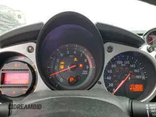 2014 Nissan 370Z Nismo z VIN JN1AZ4EH0EM634461, wystawiony jako Copart lot #53375685 z przebiegiem 171 858 mil mil oraz Szkoda całkowita • Salvage title. Historia ofert i sprzedaży dostępna na DreamBid. Obrazek 9.