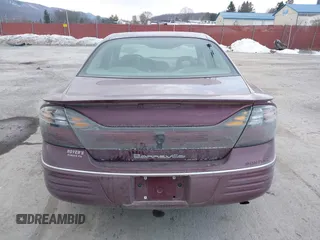 2001 Pontiac Bonneville SE z VIN 1G2HX54K914293726, wystawiony jako IAAI lot #41373612 z przebiegiem 120 117 mil mil oraz . Historia ofert i sprzedaży dostępna na DreamBid. Obrazek 16.