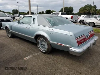 1977 Ford Thunderbird z VIN 7G87S303225, wystawiony jako Copart lot #74216404 z przebiegiem 48 305 mil mil oraz Szkody całkowita. Historia ofert i sprzedaży dostępna na DreamBid. Obrazek 2.