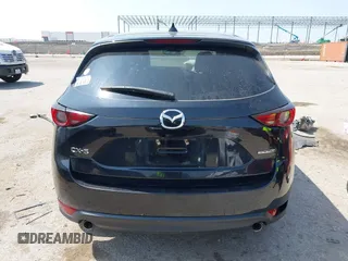 2020 Mazda CX-5 Grand Touring with VIN JM3KFADM1L0781634, listed as a IAAI auction lot 42333769 with 103,080 mi miles and . Bid and sale history available at DreamBid. Image 16.
