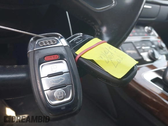 2011 Audi A8 with VIN WAURVAFD4BN019033, listed as a IAAI auction lot 42532173 with 97,486 mi miles and . Bid and sale history available at DreamBid. Image 11.