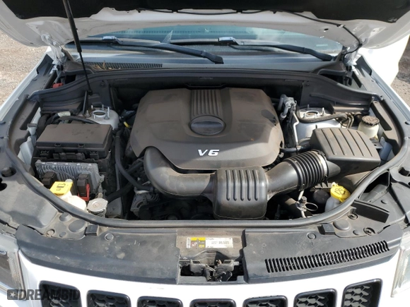 2014 Jeep Grand Cherokee Laredo with VIN 1C4RJEAG7EC410071, listed as a Copart auction lot 49717765 with 68,871 mi miles and Clean Title. Bid and sale history available at carsss.com. Image 12.