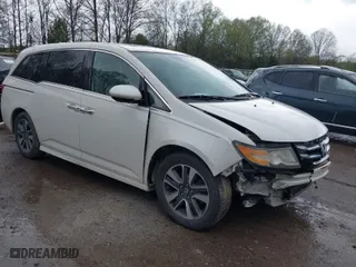 2015 Honda Odyssey Touring Elite with VIN 5FNRL5H98FB076428, listed as a IAAI auction lot 41998339 with 114,573 mi miles. Bid and sale history available at carsss.com. Image 1.