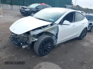 2021 Tesla Model Y Performance with VIN 5YJYGDEF1MF262930, listed as a IAAI auction lot 41606321 with 28,882 mi miles and . Bid and sale history available at DreamBid. Image 2.
